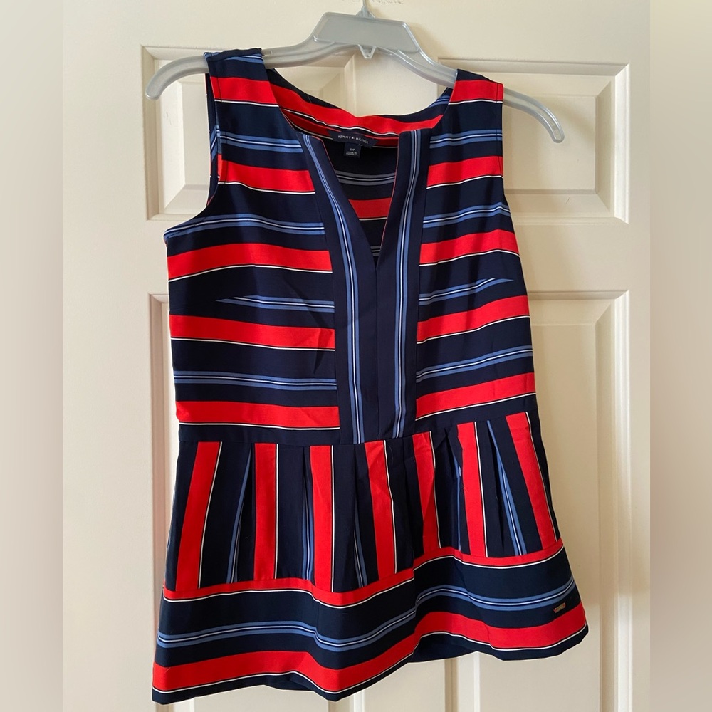 Red and blue sleeveless blouse with flared bottom